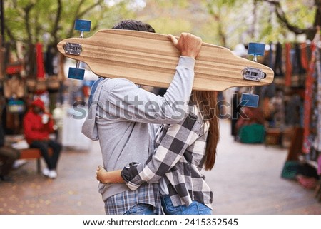 Couple, hide with skateboard and outdoor in city, hug and excited to learn together and romantic relationship. Cape town, touch and hobby with boyfriend and girlfriend in street, love and dating