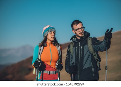 Couple Hikers On A Mountaintop