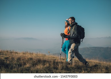 Couple Hikers On A Mountaintop