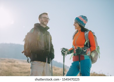 Couple Hikers On A Mountaintop