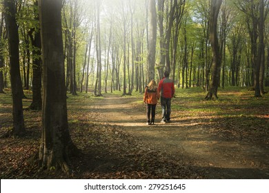 Couple Hiking In The Forest