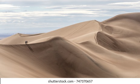 Couple hiking at Great Sand Dunes National Park, Colorado