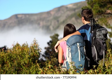 Couple Hiking Looking At View During Hike In Forest On Tenerife, Canary Islands, Spain