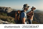 Couple, hiking and mountain on cliff outdoor for fitness travel, adventure view and backpack journey. People, backpacking and trekking together for cardio exercise, rock climbing and health in summer