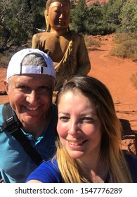 Couple Hiking In Sedona , Arizona