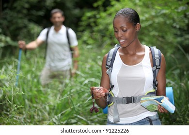 Couple hiking together - Powered by Shutterstock