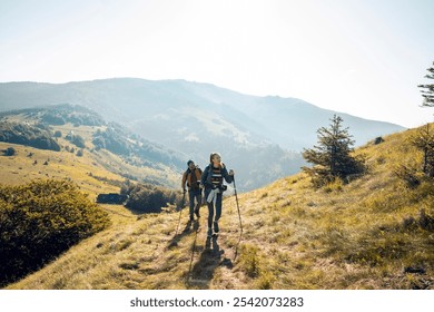 Couple hiking together on a scenic mountain trail - Powered by Shutterstock