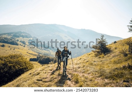 Similar – Image, Stock Photo Hiking in mountains. Mountain landscape. Scenic view of mountain peaks. Panoramic view. Natural scenery. Beautiful background