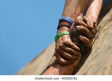 Couple hold hands,help when overcoming hindrances mud - Shutterstock ID 455003761