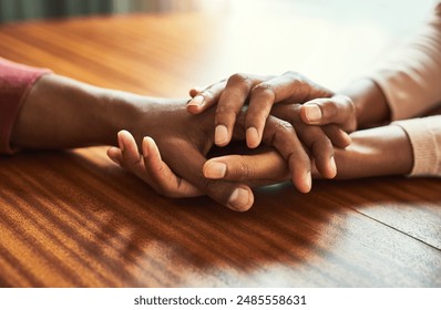 Couple, holding hands and above for empathy in home for care, connection and motivation for mental health. People, comfort and partner for help with kindness, bonding and support for grief on table - Powered by Shutterstock