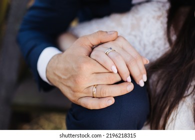 Couple holding hands. Bride and groom wedding photoshoot. Wedding ring and engagement ring on finger closeup. Love background. Being together in marriage. Symbol of love. Wife and husband. - Shutterstock ID 2196218315