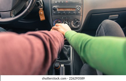 Couple Holding Hands In The Car. Concept About Love And Transportation