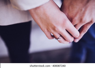 A Couple Holding Hands. Closeup