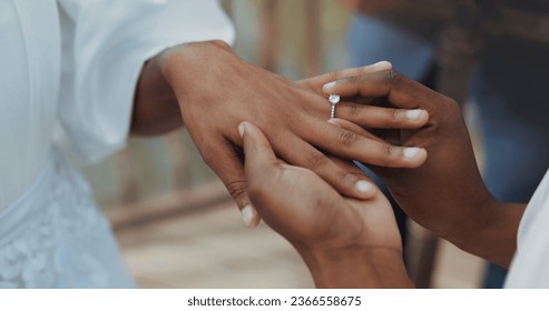 Couple, holding hands and jewellery for wedding, commitment or marriage union or ceremony with closeup outdoor. People, man and woman getting married for love, celebration and support with ring bond - Powered by Shutterstock