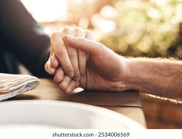 Couple, holding hands and lunch with praying, love and trust in marriage, hope and care at table outdoor. Man, woman and hand for hope, gratitude and prayer in Christian faith, spiritual or support - Powered by Shutterstock