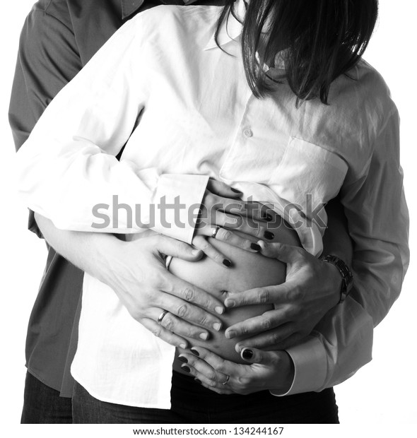 Couple Holding Hands On Pregnant Woman Stock Photo (Edit Now) 134244167