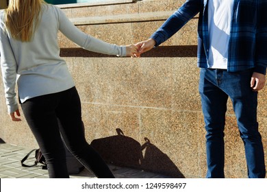 Couple Holding Hands On The Street, Parting, Let Go Of The Man's Hand. Let Go Of Love Parting