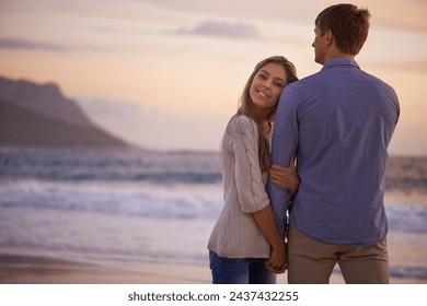 Couple, holding hands and portrait in embrace by water, ocean and peace for romance in relationship. People, love and security in marriage, sea and travel together on vacation or holiday for date - Powered by Shutterstock