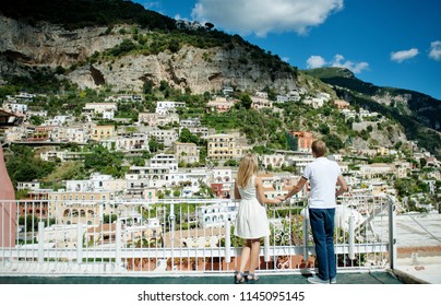 Couple Holding Hands In Positano, Amalfi Coast, Italy. Love Concept