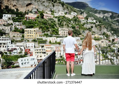 Couple Holding Hands In Positano, Amalfi Coast, Italy