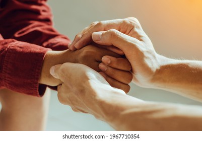 Couple are holding hands and pray together  - Shutterstock ID 1967710354