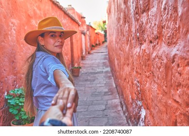Couple holding hands in Santa Catalina Monastery, Convento de Santa Catalina, Arequipa, Peru. South America - Shutterstock ID 2208740087