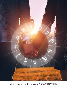 Couple holding hands at sunset. Concept of love compatibility between zodiac signs. Horoscope astrology zodiac.  - Shutterstock ID 1994392382
