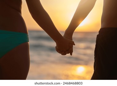 Couple, holding hands and together by beach with love on tropical vacation, romantic getaway and journey for travel adventure. Man, woman and ocean in Maldives for holiday, commitment and support. - Powered by Shutterstock