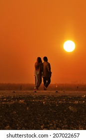 Couple Holding Hands Walking Away