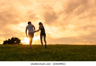 Couple Holding Hands Walking Away