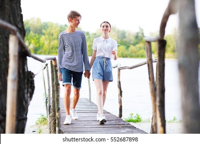 Couple Holding Hands Walking Away