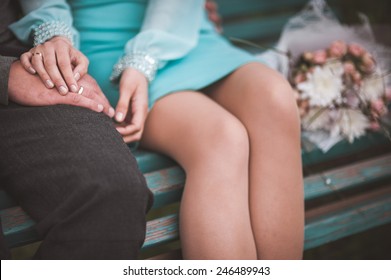 Couple Holding Hands While Sitting Together No Face 