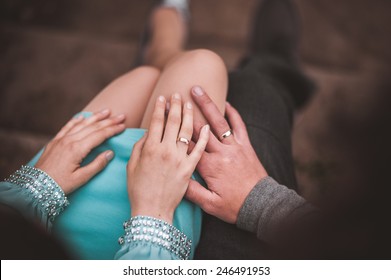 Couple Holding Hands While Sitting Together No Face 