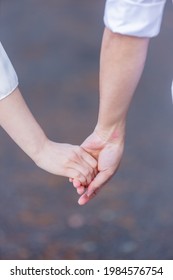 Couple Holding Hands Without Letting Go