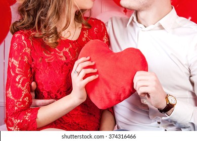 Couple Holding Heart Shaped Pillow