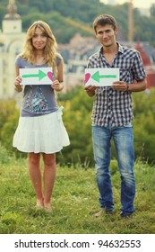 Couple Holding A Love A Sign