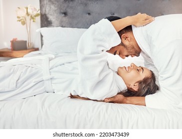 Couple holiday, hotel bedroom and happy on luxury vacation for wedding celebration, smile for love on bed and happiness hug together in house. Man and woman relax with romance in house apartment