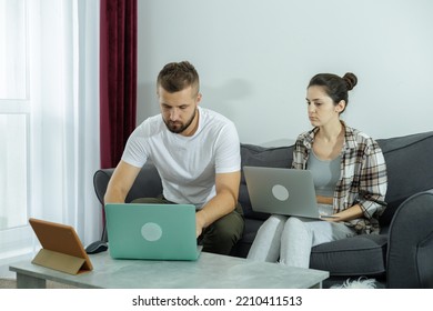 Couple at home doing online shopping with laptop - Shutterstock ID 2210411513