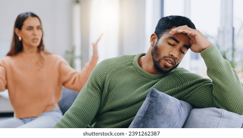 Couple, home and fight on couch, sad and angry with stress, mental health and headache with relationship crisis. Man, woman and questions on lounge sofa with conflict, anxiety and mistake in marriage - Powered by Shutterstock