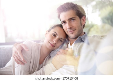 Couple At Home Relaxing In Sofa