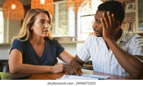 Couple At Home Worried About Debt Bills And Rising Cost Of Living - Powered by Shutterstock