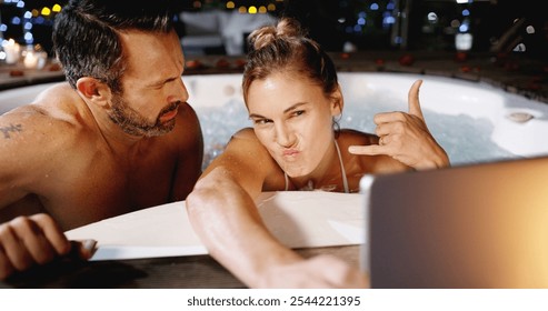 Couple, hot tub and selfie with tablet, together and night on holiday, love or shaka sign at luxury resort. Woman, man and pout with emoji for memory, app and comic profile picture for social network - Powered by Shutterstock