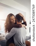 Couple, hug and laughing in home on kitchen counter with love, bonding and smile together with joy. Embrace, romance and happy people with marriage with care, trust and commitment in house with fun