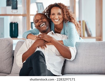 Couple, hug and laughing on sofa portrait in home living room, bonding and having fun. Interracial, love and funny black man and woman on couch embrace, happiness and enjoying quality time together. - Shutterstock ID 2283297171