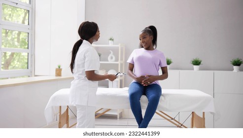 Couple IVF Fertility And Medical Doctor Checkup In Clinic - Powered by Shutterstock