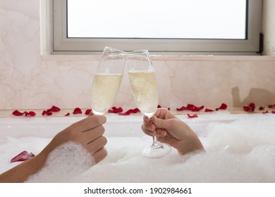 Couple with jacuzzi champagne bubbles