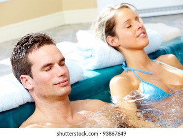 Couple in jacuzzi. Spa and relax.
