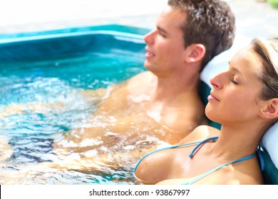 Couple In Jacuzzi. Spa And Relax.