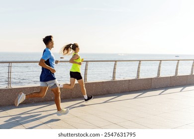 Couple Jogging Along a Seaside Promenade During a Bright and Sunny Morning - Powered by Shutterstock