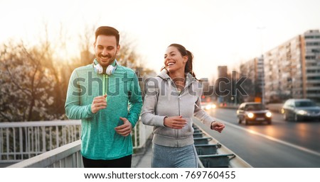 Couple jogging outdoors
